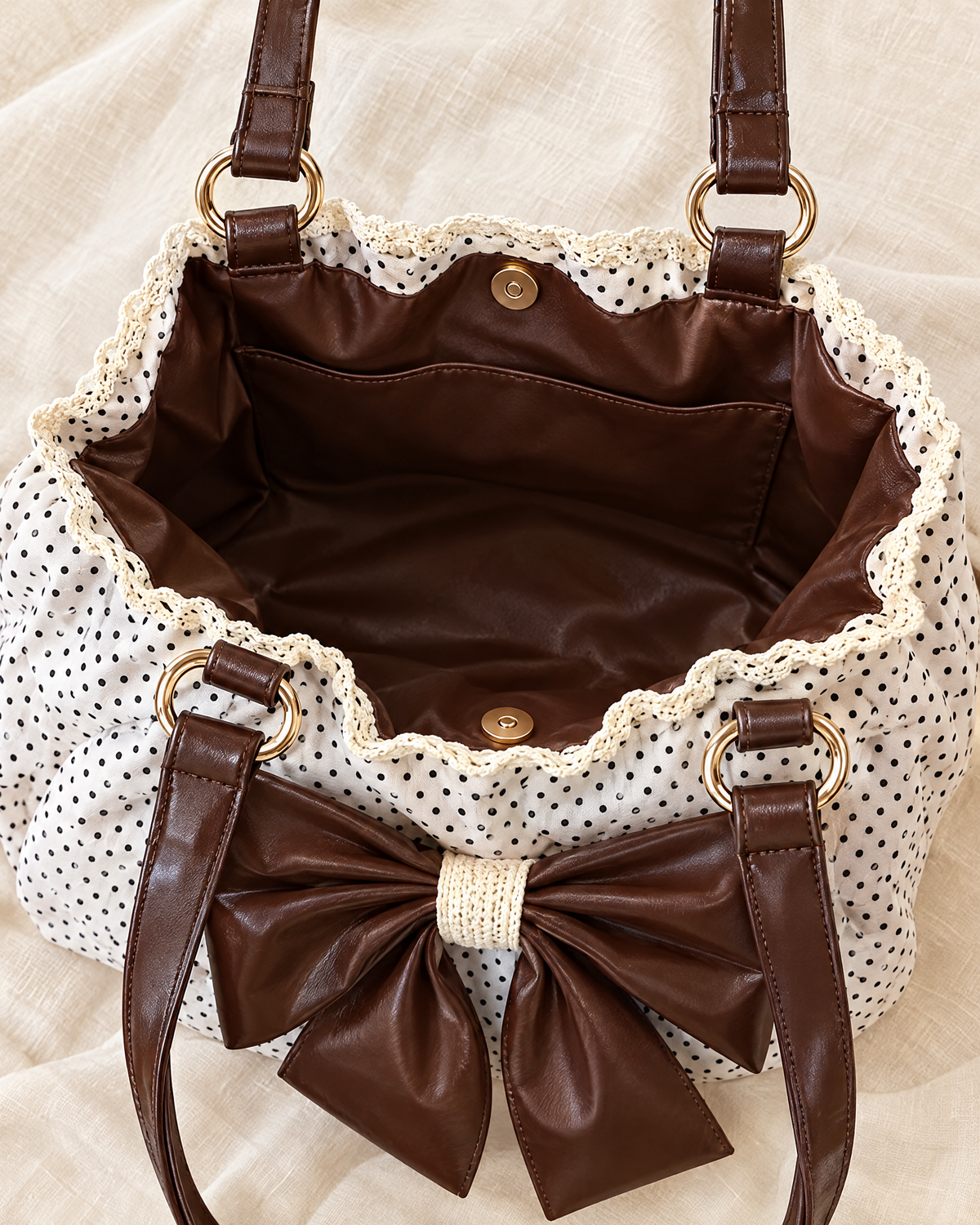 Inside the Colette Bow Bag: vegan-leather lining and magnetic snap